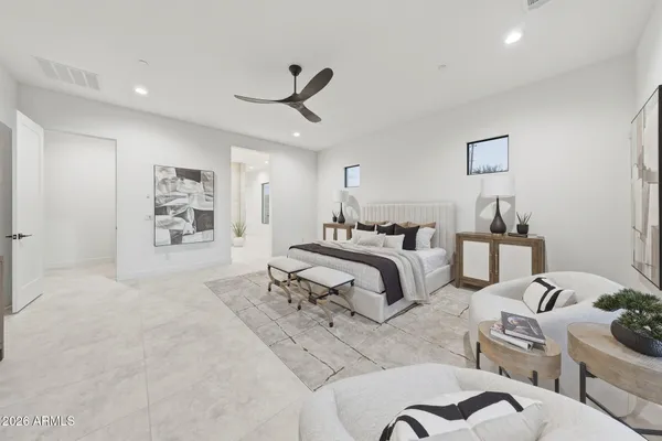 a bedroom with a bed and ceiling fan