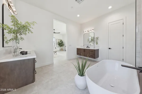 a living room with furniture and potted plant