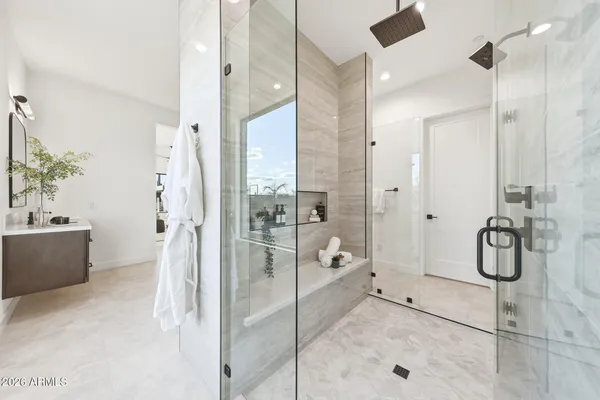 a bathroom with a shower and a sink