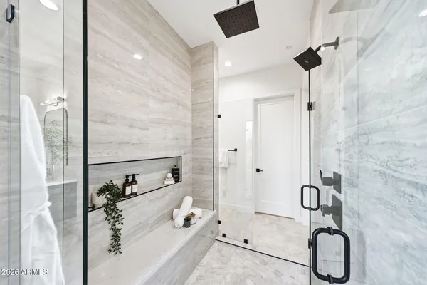 a bathroom with a tub and shower
