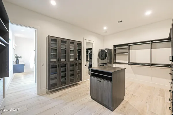 a kitchen with stainless steel appliances granite countertop a stove a refrigerator and a cabinets