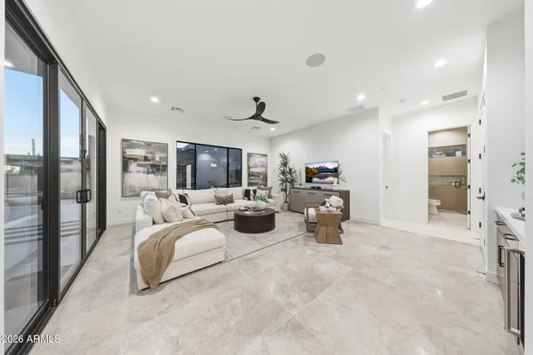 a living room with furniture and a large window