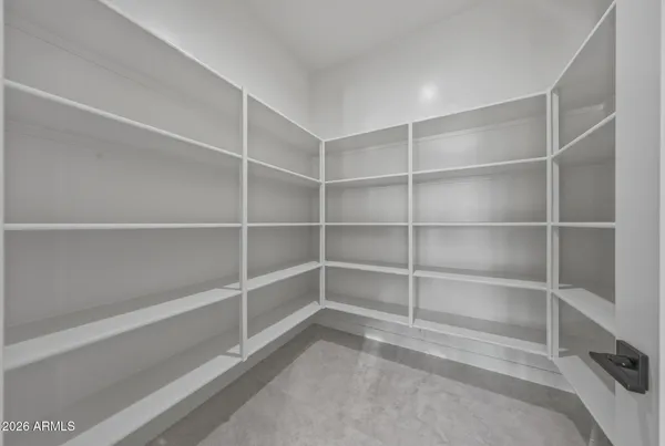 a living room with fireplace furniture and a large window