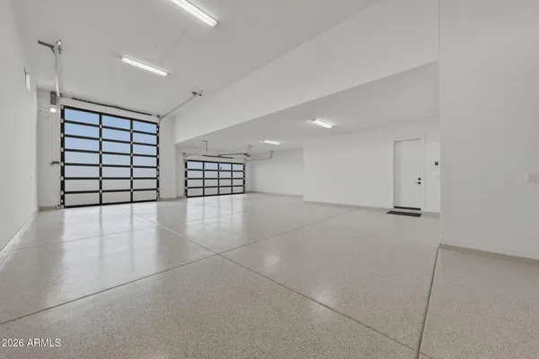 a living room with fireplace furniture and a large window