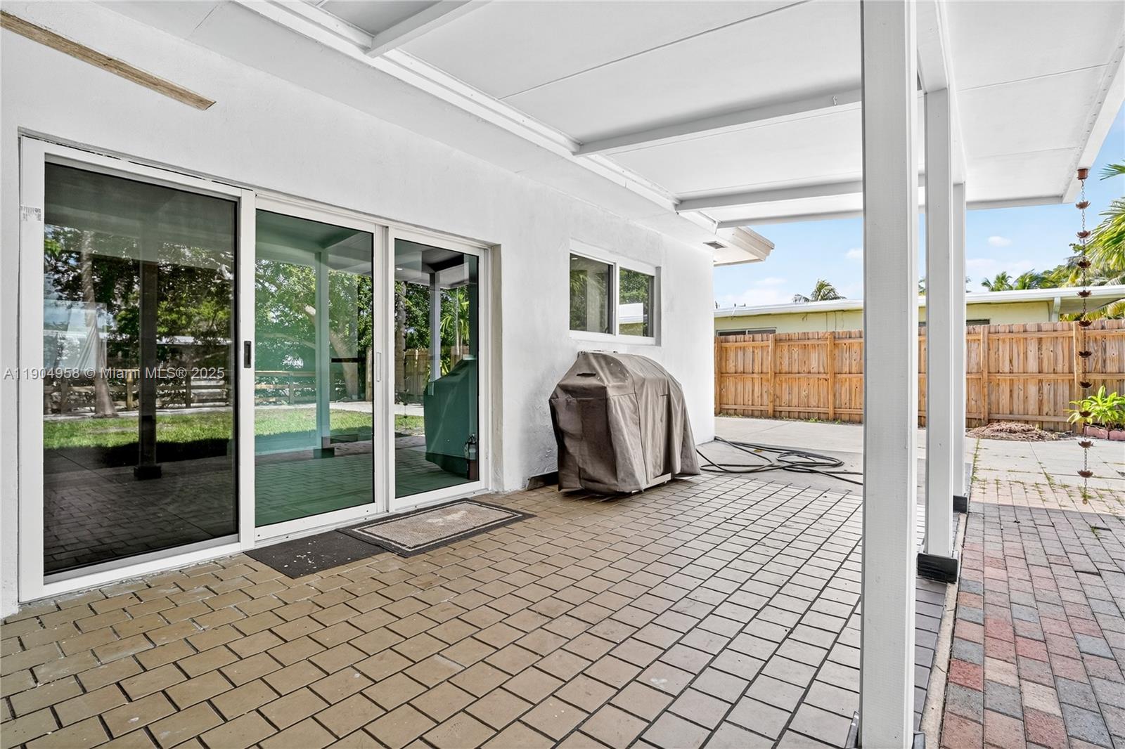 2325 Northeast 194th Street Miami, FL 33180 - Photo 14 of 36 a living room with a large window and furniture