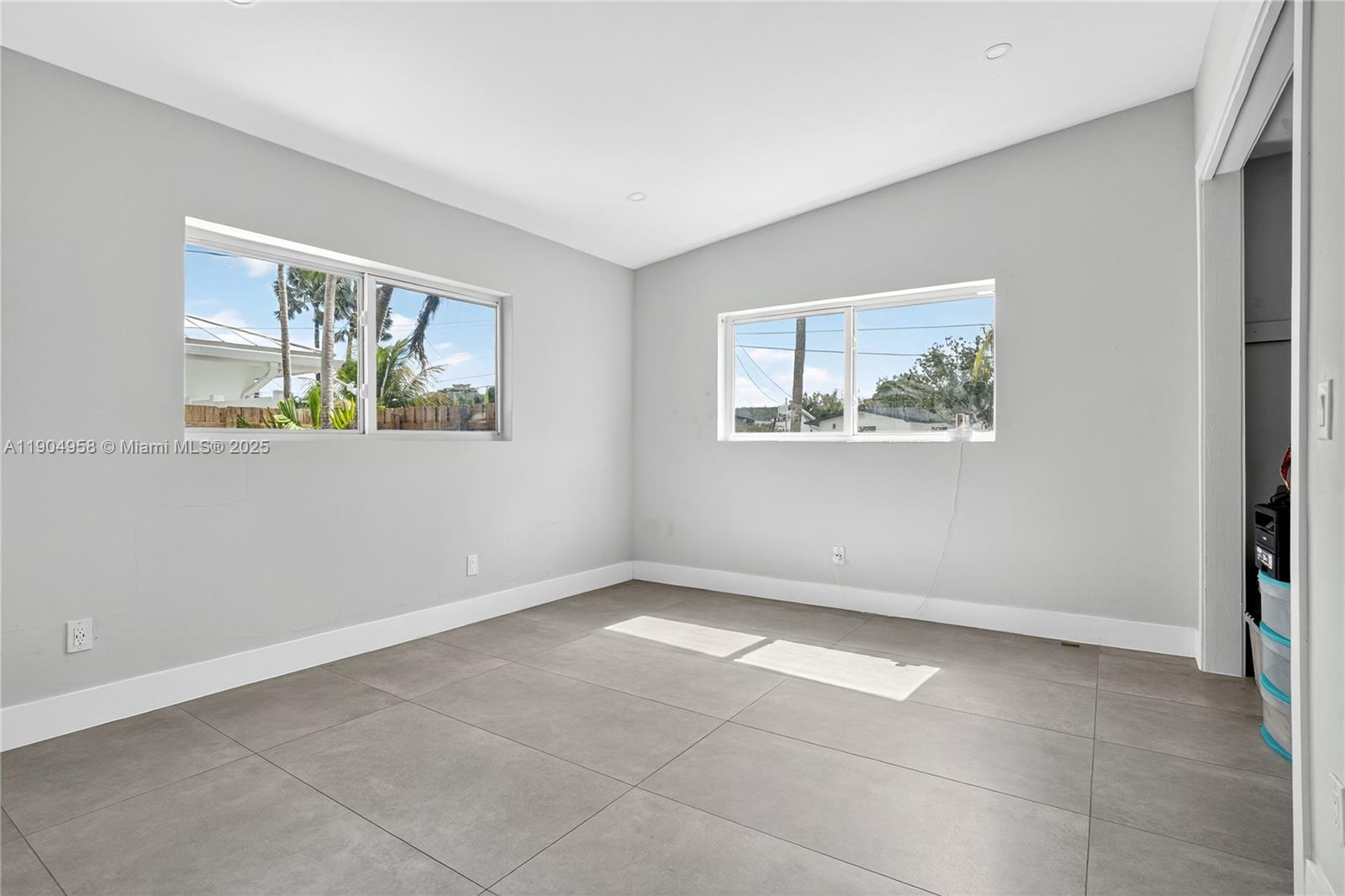 2325 Northeast 194th Street Miami, FL 33180 - Photo 15 of 36 a view of an empty room with a window