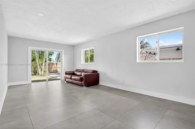 a view of livingroom with furniture and window