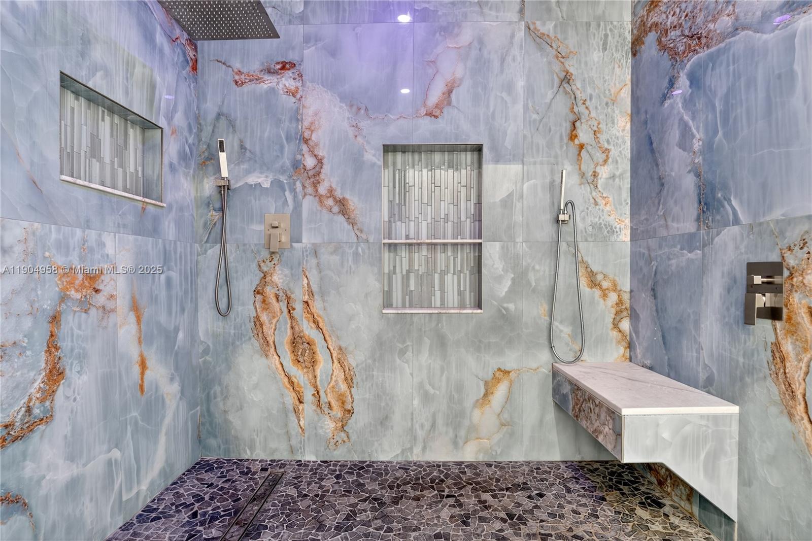 2325 Northeast 194th Street Miami, FL 33180 - Photo 26 of 36 a bathroom with a bathtub