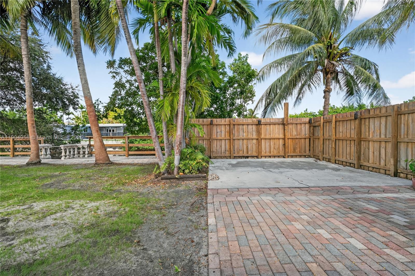 2325 Northeast 194th Street Miami, FL 33180 - Photo 27 of 36 a view of outdoor space with a garden