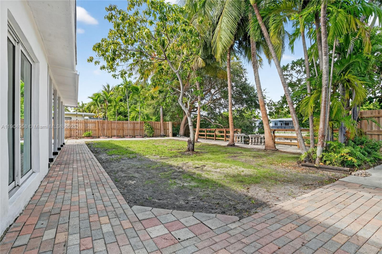 2325 Northeast 194th Street Miami, FL 33180 - Photo 28 of 36 a view of a yard with plants