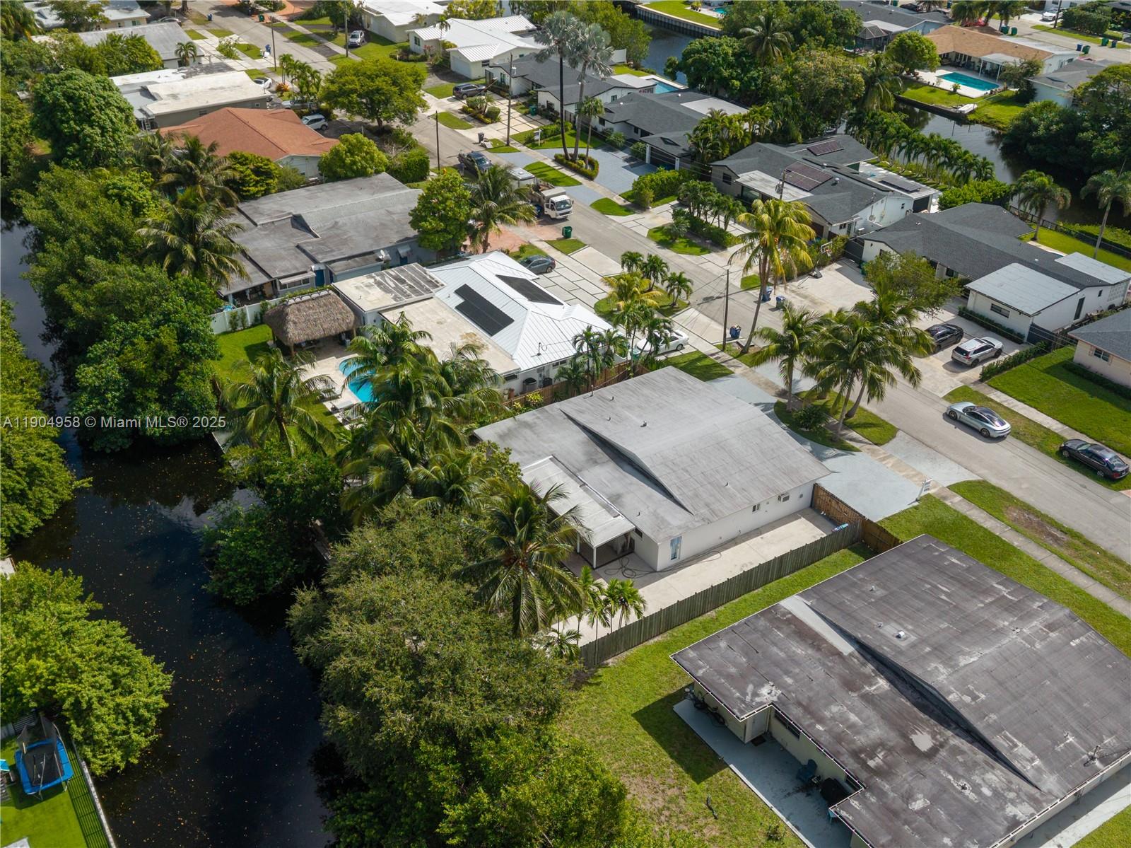 2325 Northeast 194th Street Miami, FL 33180 - Photo 32 of 36 an aerial view of a house with a garden