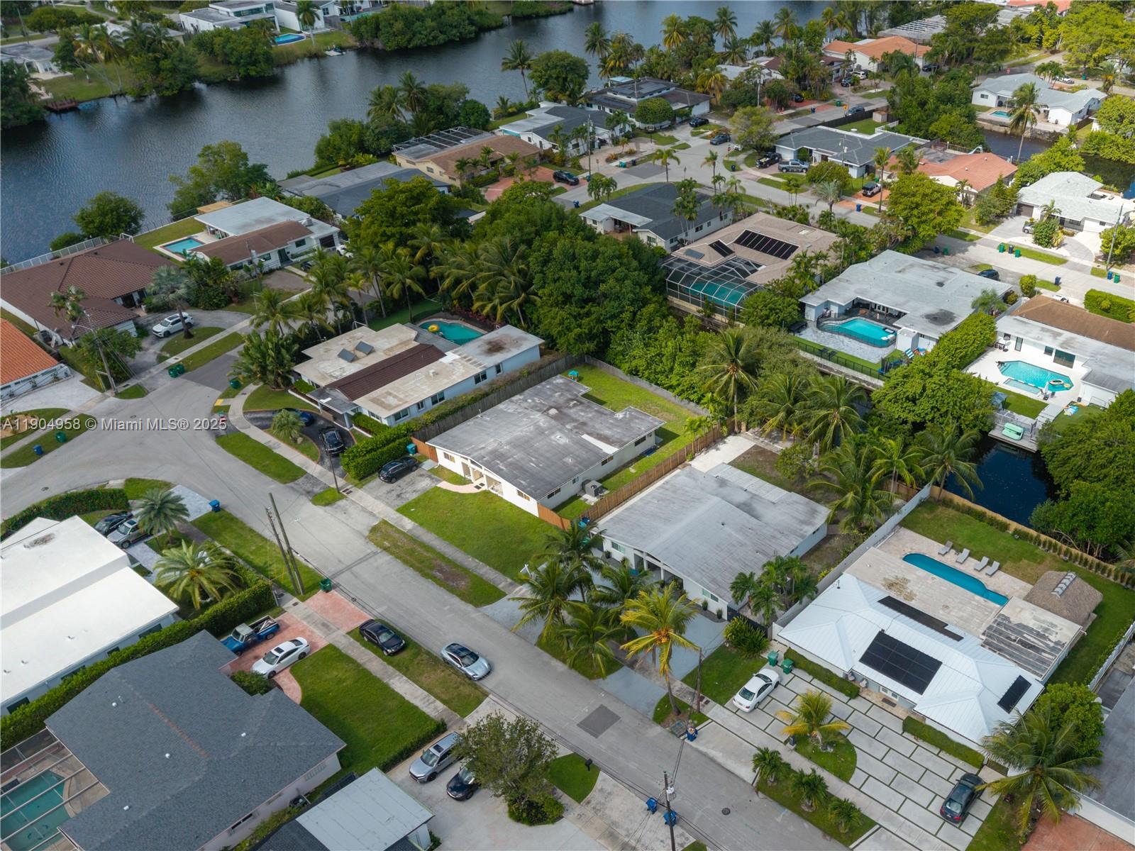 2325 Northeast 194th Street Miami, FL 33180 - Photo 35 of 36 an aerial view of residential houses with outdoor space and lake view