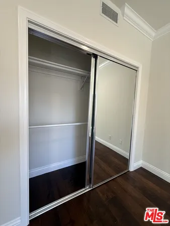 a view of an empty walk in closet