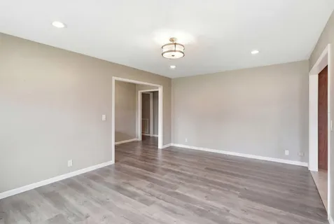 a view of walk in closet with empty racks