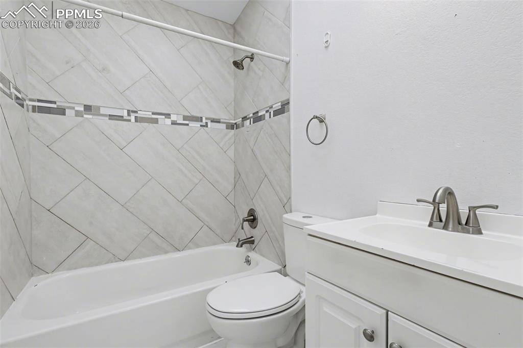 585 Blossom Field Road Fountain, CO 80817 - Photo 22 of 37 a bathroom with a sink toilet and shower