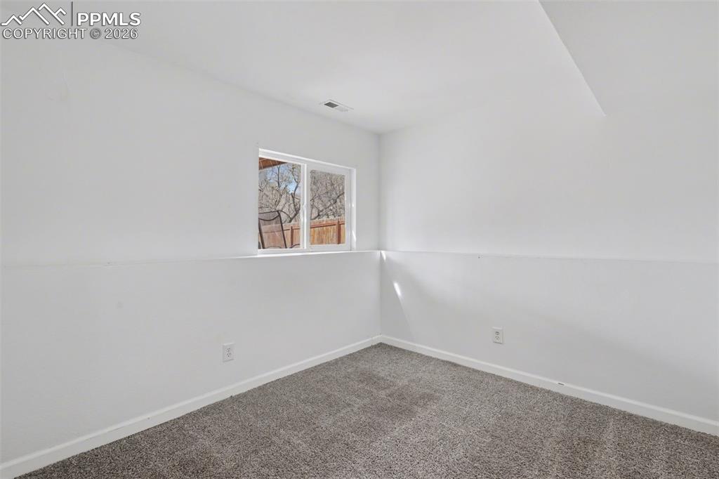 585 Blossom Field Road Fountain, CO 80817 - Photo 24 of 37 an empty room with a window