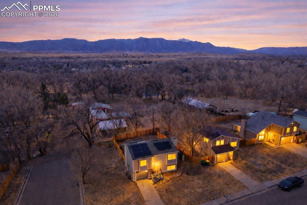 585 Blossom Field Road Fountain, CO 80817 - Photo 4 of 37 an aerial view of a house with a mountain view