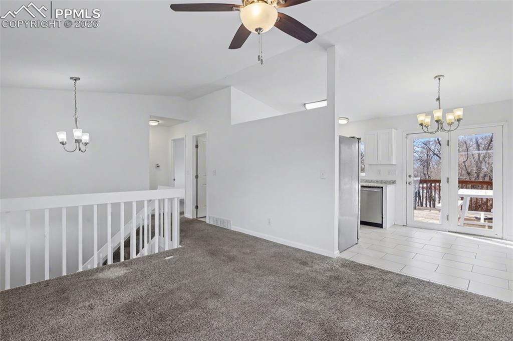 585 Blossom Field Road Fountain, CO 80817 - Photo 7 of 37 a view of a hallway with a chandelier