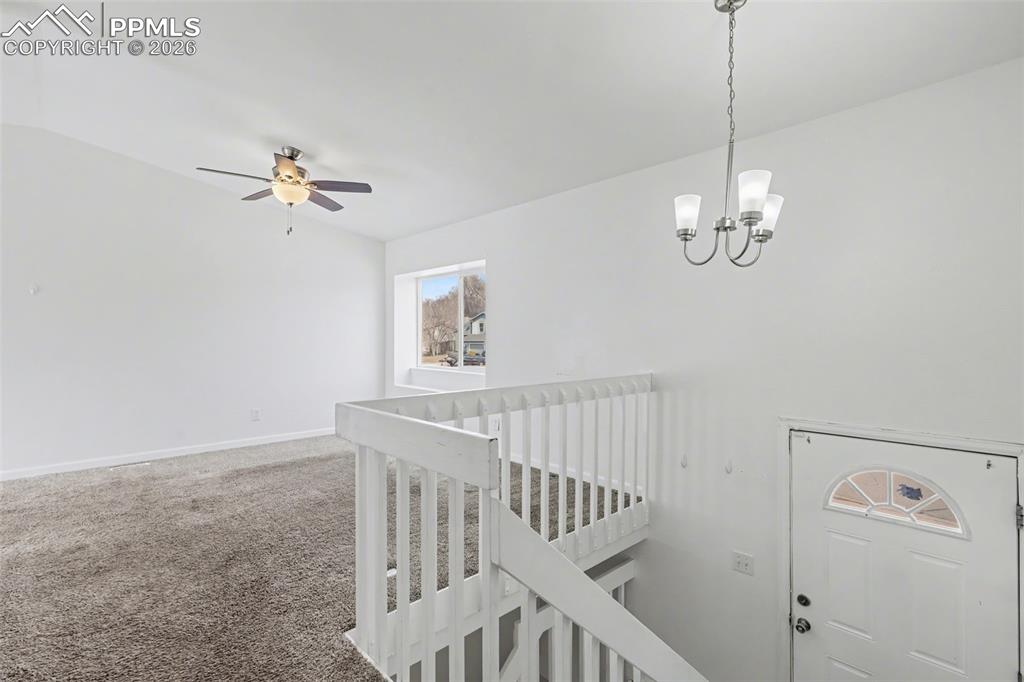 585 Blossom Field Road Fountain, CO 80817 - Photo 9 of 37 a view of an empty room with a fan