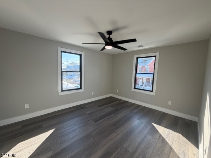 1122 East Boulevard, Unit A Alpha, NJ 08865 - Photo 15 of 15 wooden floor in an empty room with a window