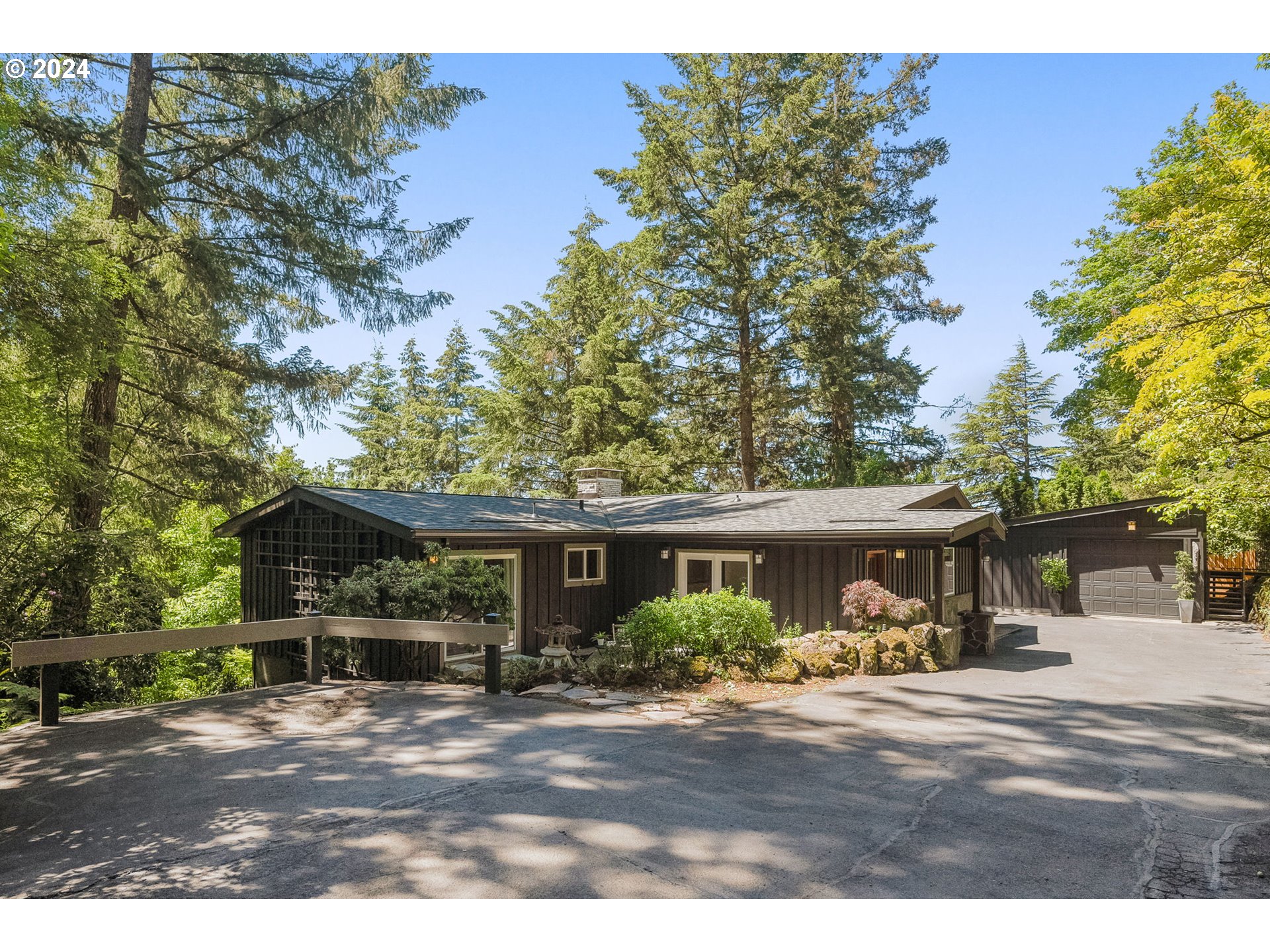 4215 Southwest Dosch Road Portland, OR 97239 - Photo 3 of 48 a view of a house with backyard and a tree