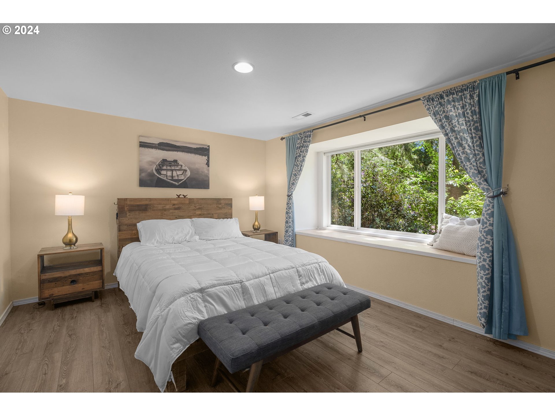 4215 Southwest Dosch Road Portland, OR 97239 - Photo 33 of 48 a bedroom with a bed and a large window