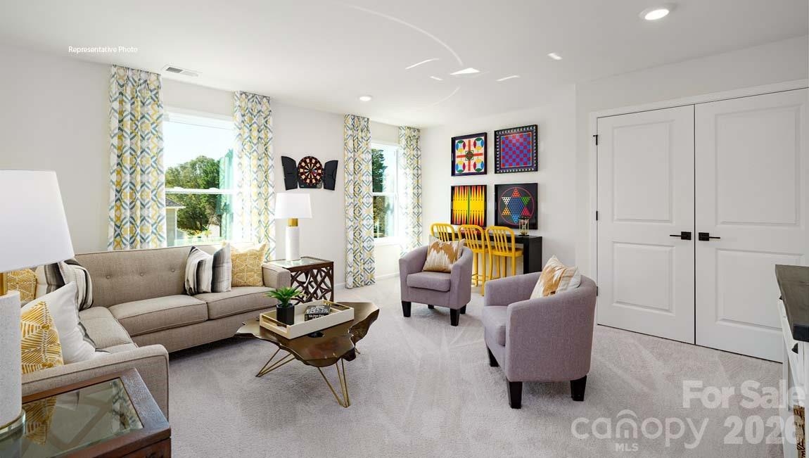 3111 Spring Iris Drive Denver, NC 28037 - Photo 14 of 44 a living room with furniture or window and a wooden floor