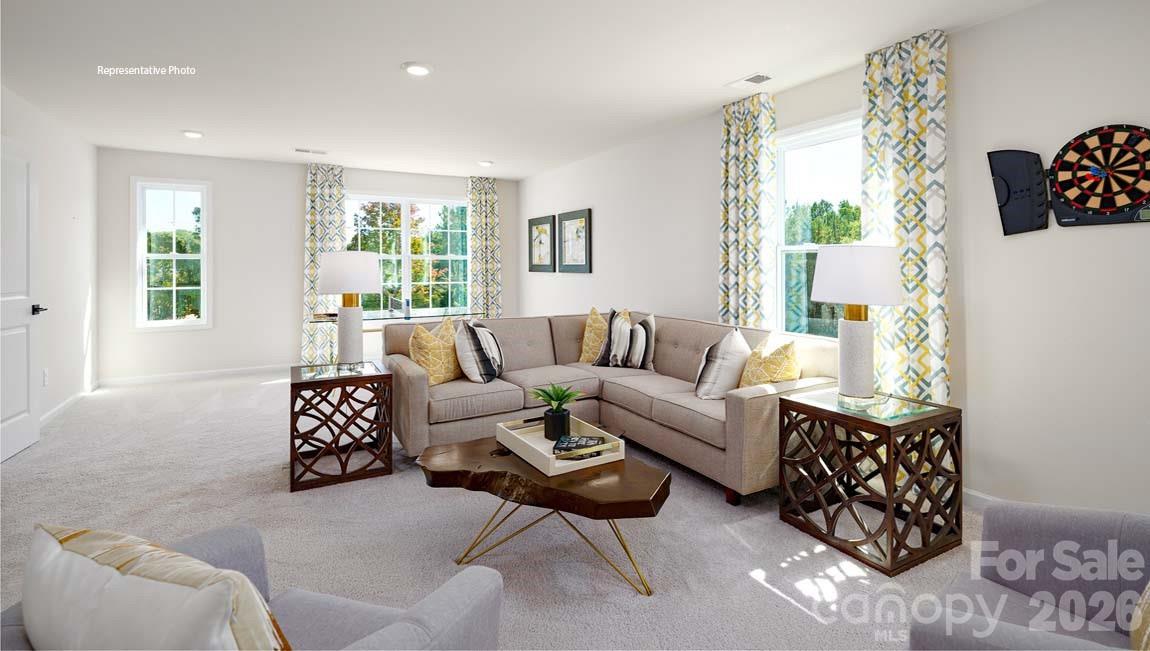 3111 Spring Iris Drive Denver, NC 28037 - Photo 16 of 44 a living room with furniture and a large window