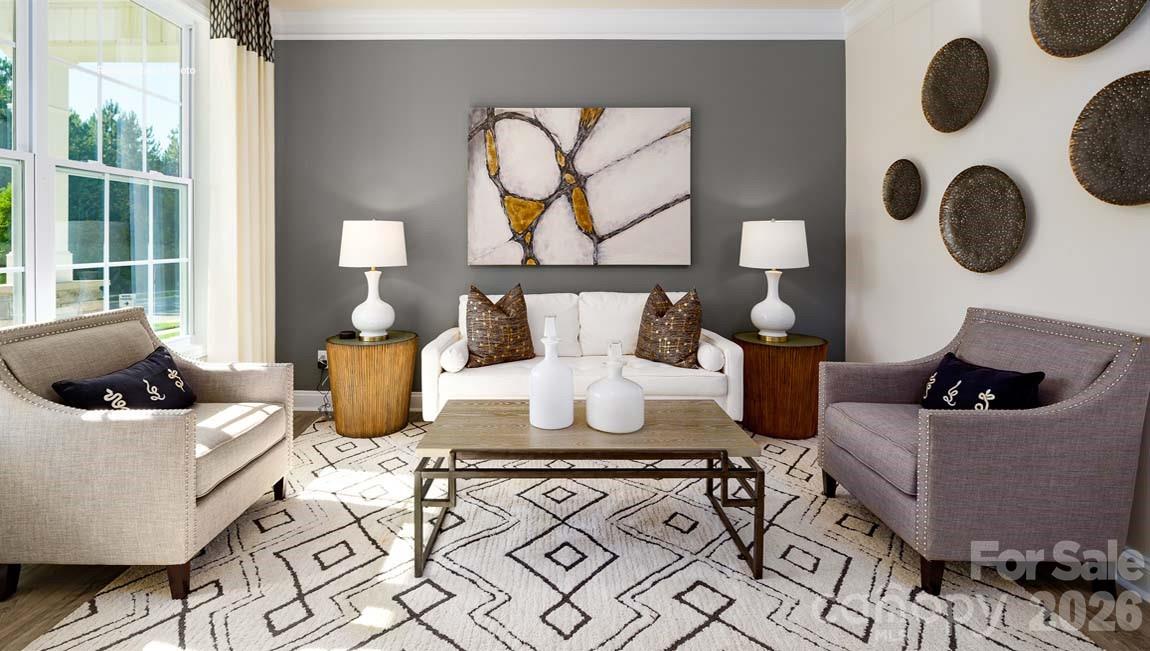 3111 Spring Iris Drive Denver, NC 28037 - Photo 18 of 44 a living room with furniture and wall clock