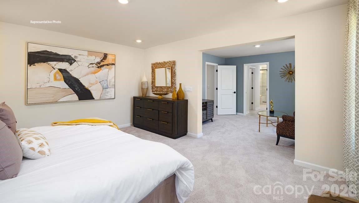 3111 Spring Iris Drive Denver, NC 28037 - Photo 23 of 44 a bedroom with a bed and a view of bathroom