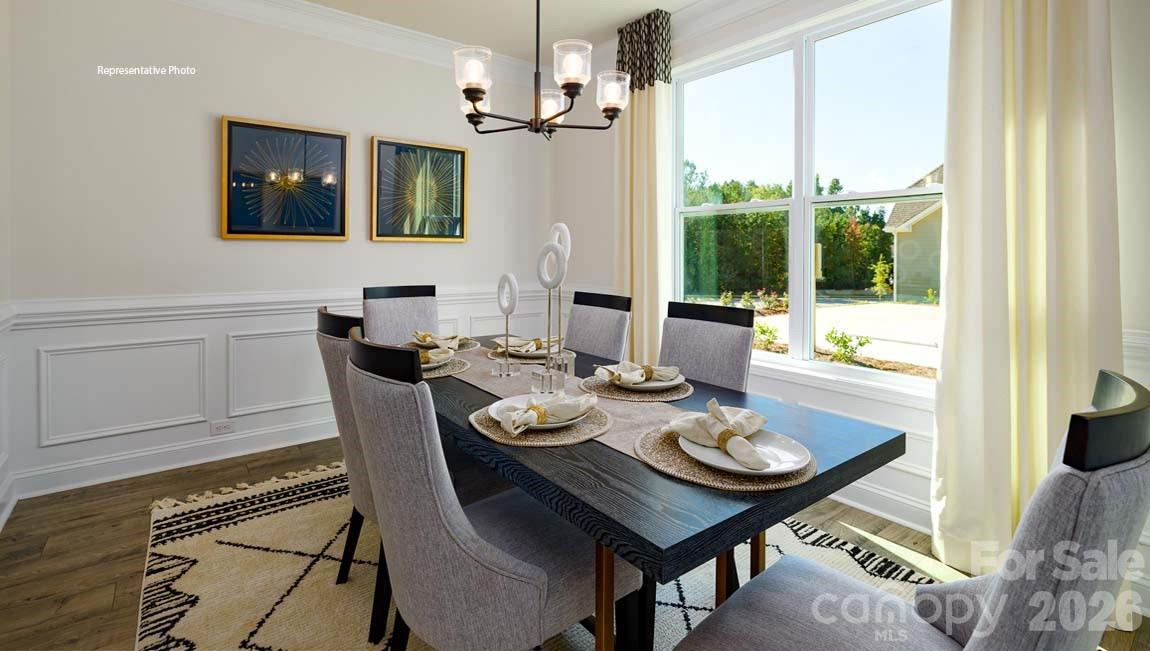 3111 Spring Iris Drive Denver, NC 28037 - Photo 10 of 44 a view of a dining room with furniture window and outside view