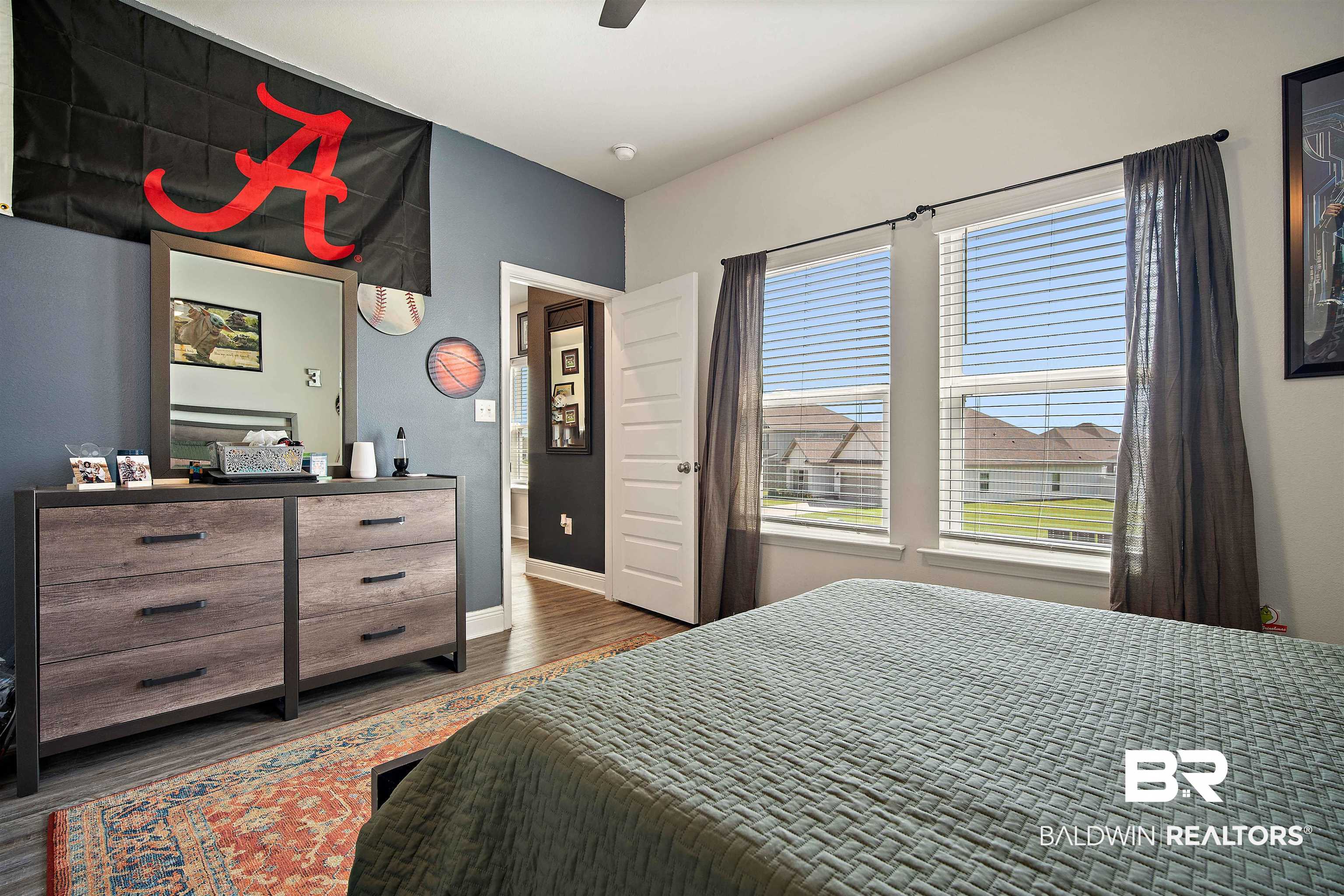 24341 Alydar Loop Daphne, AL 36526 - Photo 26 of 45 Bedroom with dark wood-type flooring and a ceiling fan