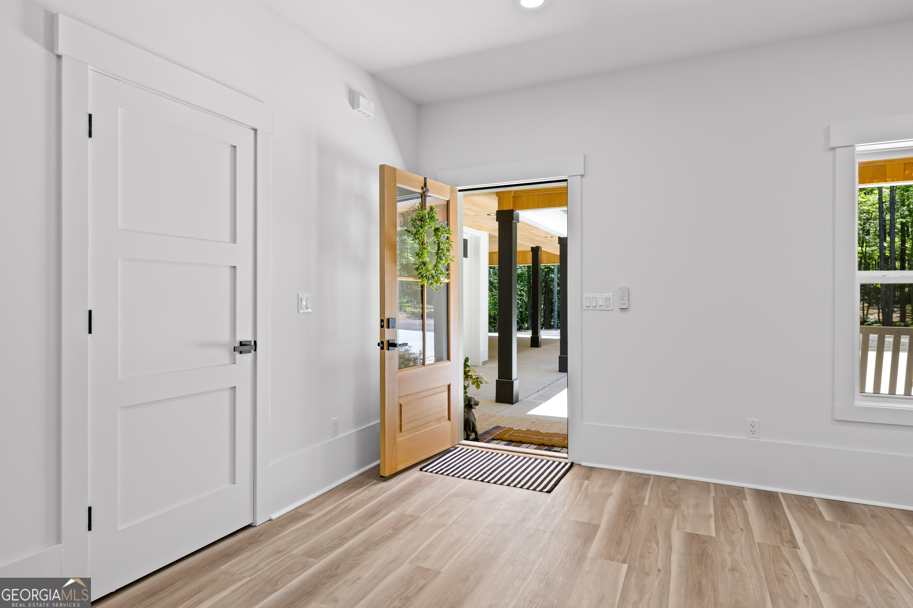 354 Turner Road Newnan, GA 30263 - Photo 8 of 79 a view of a room with wooden floor and windows