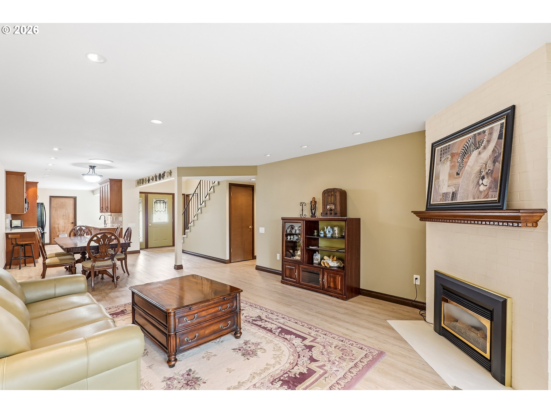 10290 Southwest Greenleaf Terrace Portland, OR 97224 - Photo 10 of 26 a living room with furniture and a fireplace