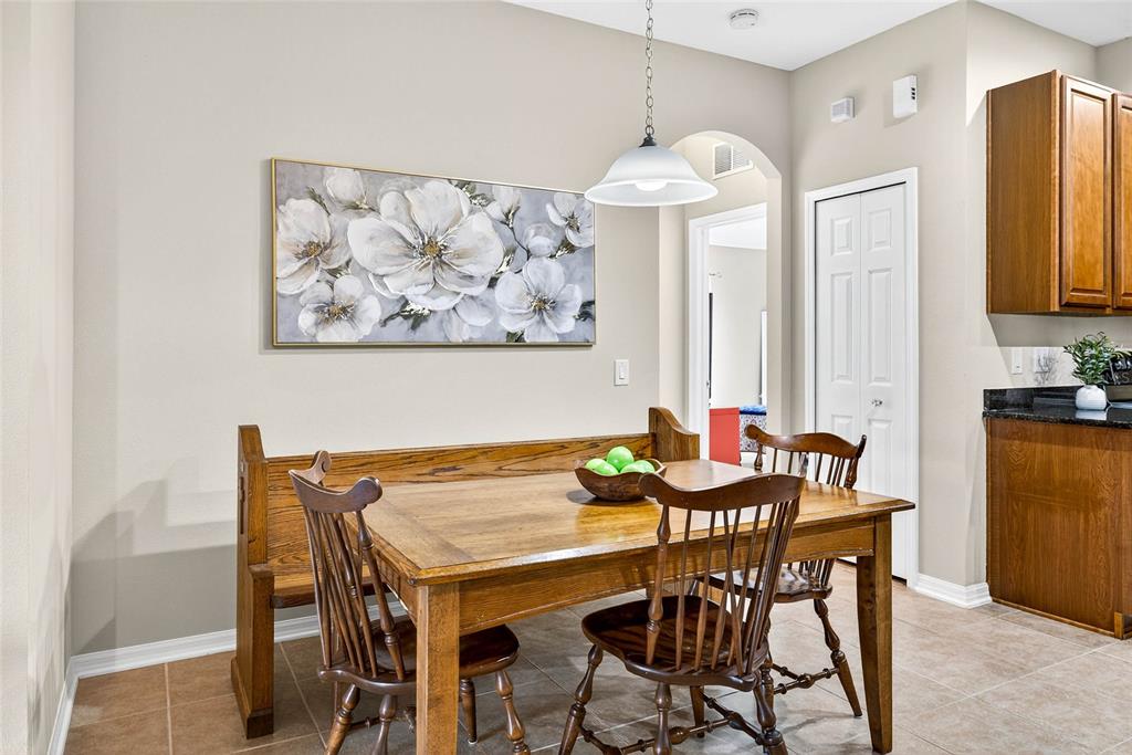 10859 Breaking Rocks Drive Tampa, FL 33647 - Photo 12 of 57 a view of a dining room with furniture and chandelier
