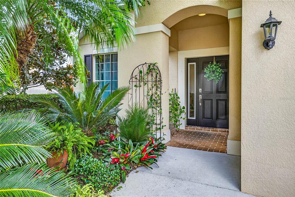10859 Breaking Rocks Drive Tampa, FL 33647 - Photo 2 of 57 a front view of a house with a porch