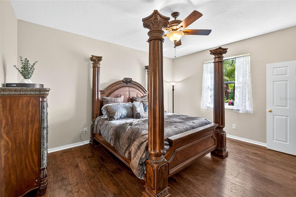 10859 Breaking Rocks Drive Tampa, FL 33647 - Photo 22 of 57 a bed sitting in a bedroom next to a window