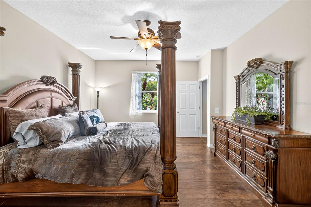 10859 Breaking Rocks Drive Tampa, FL 33647 - Photo 23 of 57 a bedroom with a bed and ceiling fan