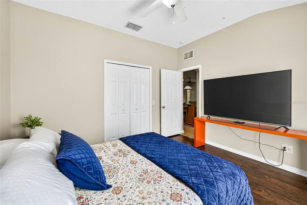 10859 Breaking Rocks Drive Tampa, FL 33647 - Photo 28 of 57 a bedroom with a bed and a flat screen tv