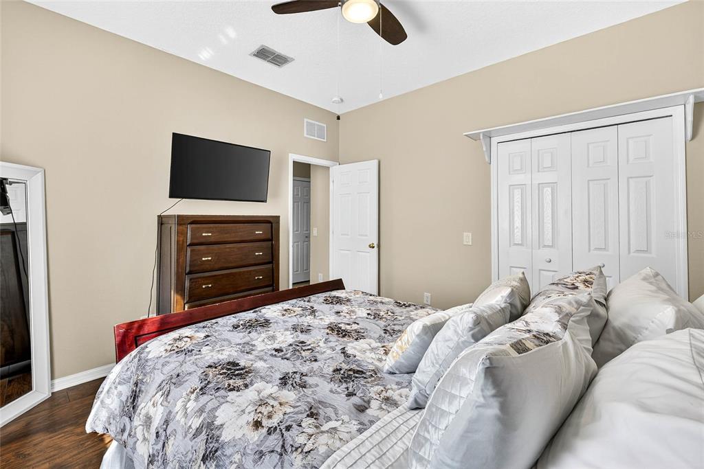 10859 Breaking Rocks Drive Tampa, FL 33647 - Photo 30 of 57 a bedroom with a bed and a television
