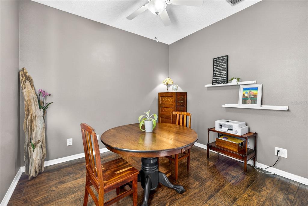10859 Breaking Rocks Drive Tampa, FL 33647 - Photo 32 of 57 a view of a dining room with furniture and wooden floor