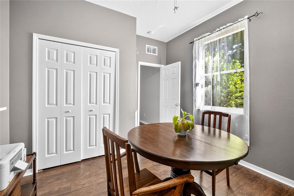 10859 Breaking Rocks Drive Tampa, FL 33647 - Photo 33 of 57 a view of a dining room with furniture window and wooden floor