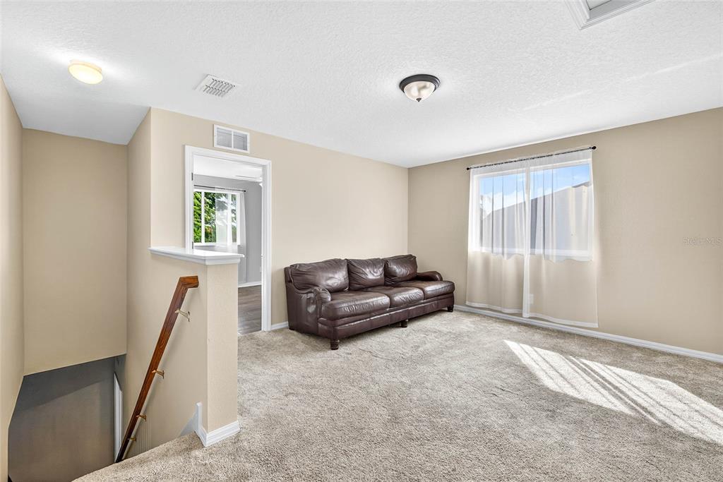 10859 Breaking Rocks Drive Tampa, FL 33647 - Photo 34 of 57 a living room with furniture and a window