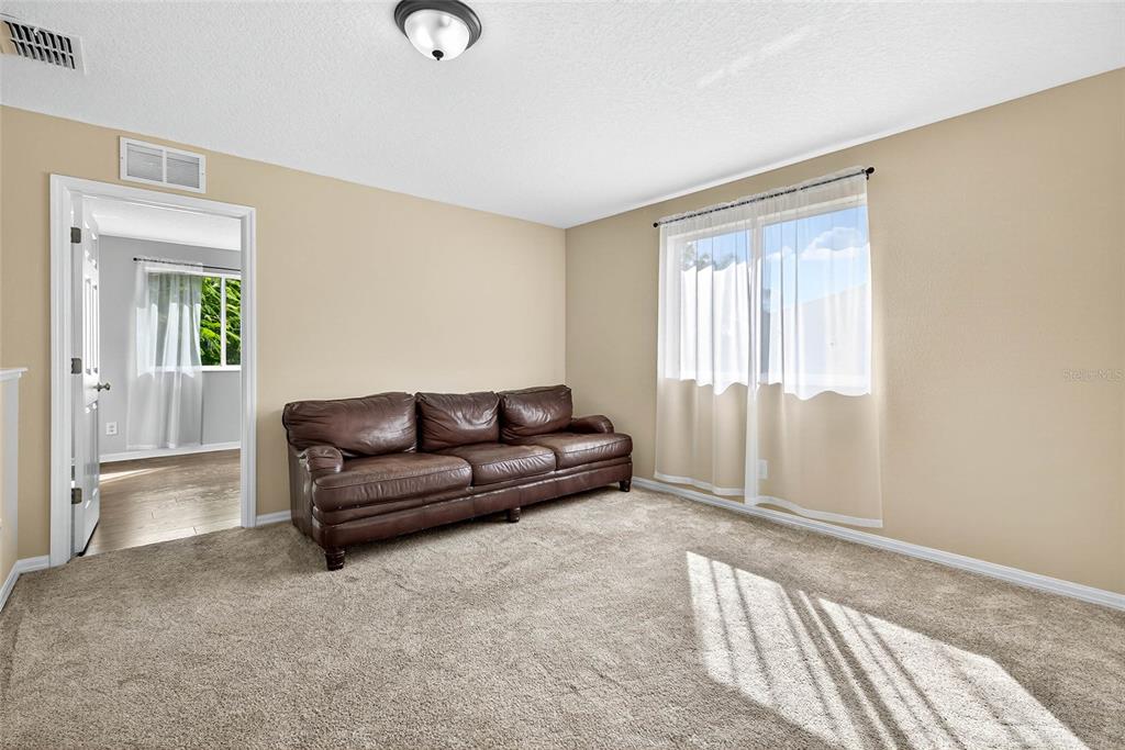 10859 Breaking Rocks Drive Tampa, FL 33647 - Photo 35 of 57 a living room with furniture and a window