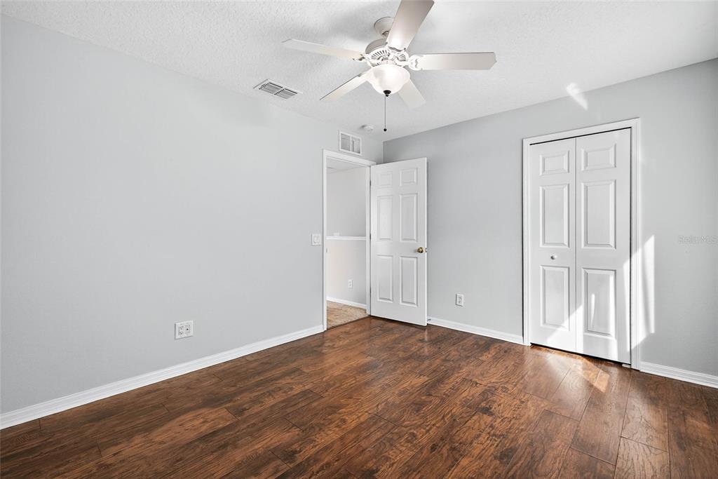 10859 Breaking Rocks Drive Tampa, FL 33647 - Photo 37 of 57 a view of an empty room with wooden floor