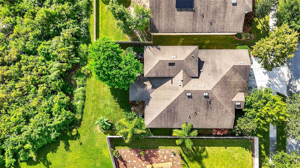 10859 Breaking Rocks Drive Tampa, FL 33647 - Photo 47 of 57 an aerial view of a house with a garden and swimming pool