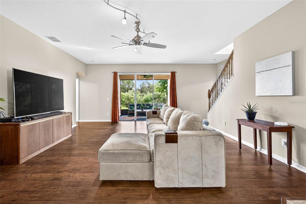 10859 Breaking Rocks Drive Tampa, FL 33647 - Photo 8 of 57 a living room with furniture and a flat screen tv