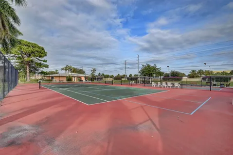 a view of an outdoor space and tennis court
