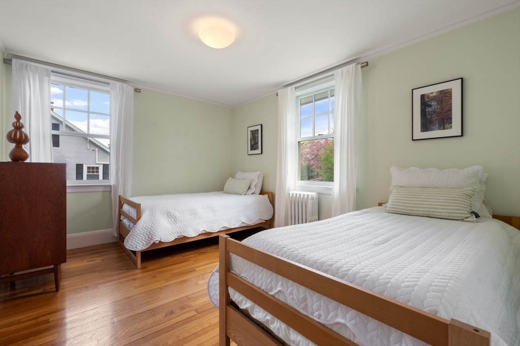 8 Charlotte Road Marblehead, MA 01945 - Photo 26 of 37 a bedroom with a bed and wooden floor