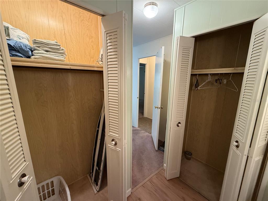 9900 Ulmerton Road, Unit 242 Largo, FL 33771 - Photo 13 of 21 a view of a hallway with wooden floor and staircase